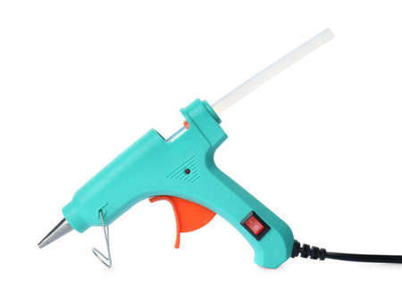 Turquoise glue gun with stick isolated on whiteの写真素材