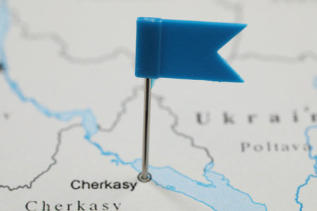 MYKOLAIV, UKRAINE - NOVEMBER 09, 2020: Cherkasy city marked with push pin on contour map of Ukraine, closeupのeditorial素材