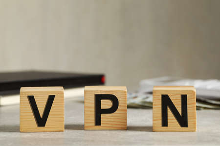 Wooden cubes with acronym VPN on gray stone tableの写真素材