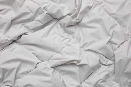 Soft crumpled blanket as background, top viewの写真素材