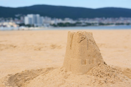 Beautiful sand castle on the beach near the sea, space for textの写真素材