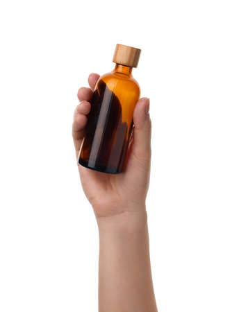 Woman holding glass empty bottle isolated on white, closeupの写真素材
