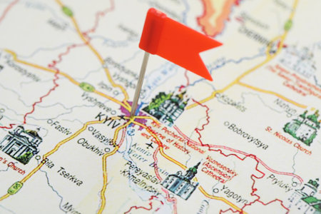 MYKOLAIV, UKRAINE - NOVEMBER 09, 2020: Kyiv city marked with push pin on map of Ukraine, closeupのeditorial素材