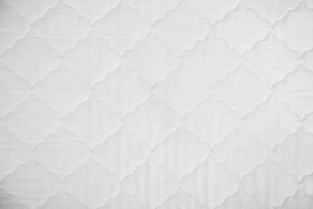 Comfortable orthopedic mattress as background, top view