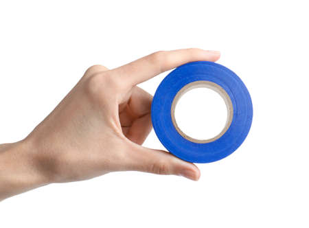 Woman holding blue insulating tape on white background, closeupの写真素材