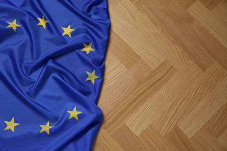 Flag of European Union on wooden table, top view. Space for textの写真素材
