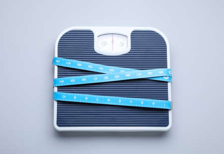 Scales and measuring tape on light gray background, top viewの写真素材