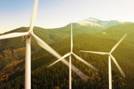 Modern wind turbines in mountains. alternative energy sources