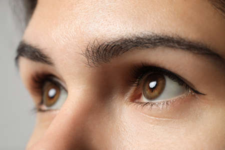 Beautiful woman with hazel eyes, closeup viewの写真素材