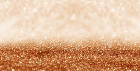Shiny orange glitter and blurred lights on background, banner design. bokeh effectの写真素材
