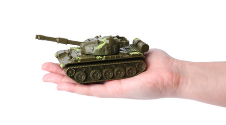 Man with toy tank on white background, closeup