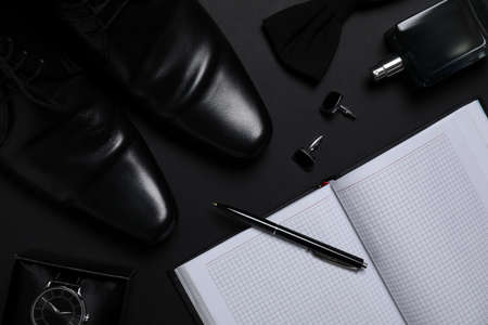 Flat lay composition with male accessories on black backgroundの写真素材