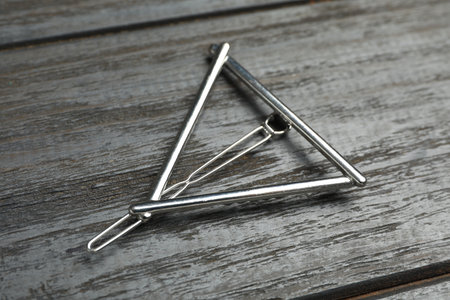 Stylish hair clip on black wooden tableの写真素材