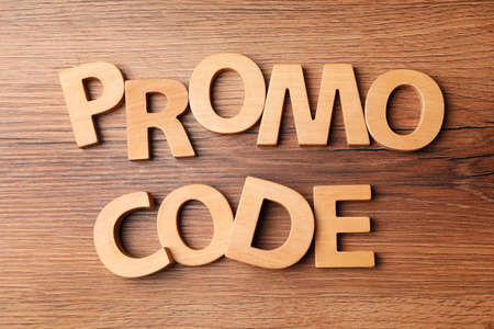 Words Promo Code made of wooden letters on table, flat layの写真素材