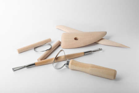 Set of clay modeling tools on white background