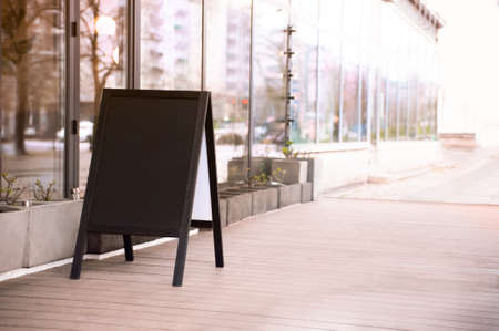 Empty A-board near building outdoors. Mockup for design