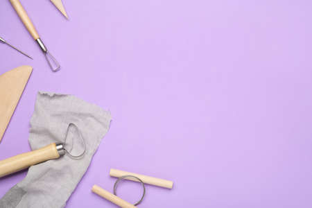 Set of clay modeling tools on blue background, flat lay. Space for textの写真素材