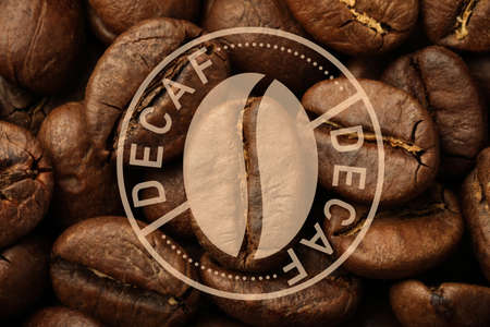 Pile of decaf coffee beans as background, closeupの写真素材