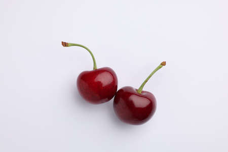 Two fresh sweet cherries on white backgroundの写真素材