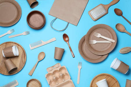 Different eco items on light blue background, flat lay. Recycling conceptの写真素材