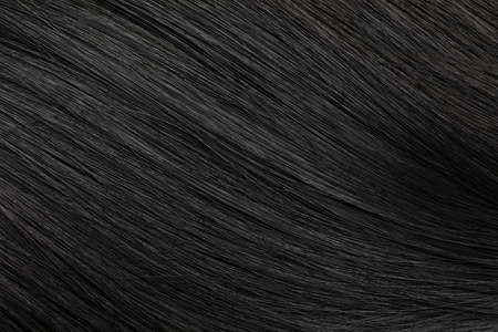 Beautiful black hair as background, closeup viewの写真素材