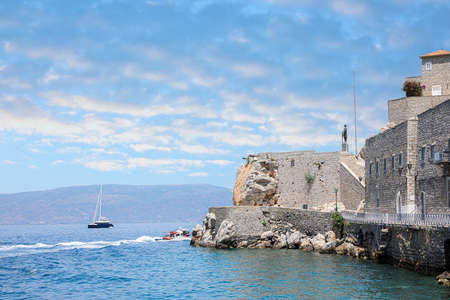Beautiful view of the sea with boats and coastal cityの写真素材