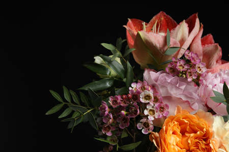 Beautiful bouquet of fresh flowers on dark background