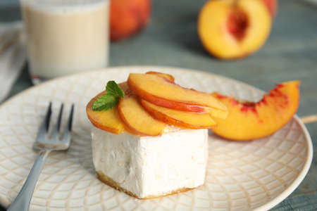 Delicious dessert with peach slices on plate, closeupの写真素材