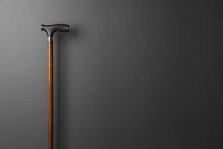 Elegant walking cane on gray background. Space for textの写真素材