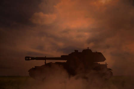 silhouette of tank on battlefield in nightの写真素材