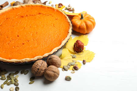 Delicious homemade pumpkin pie on white wooden tableの写真素材