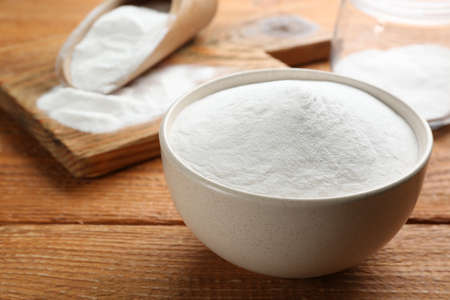 Baking soda on wooden table, closeup viewの写真素材