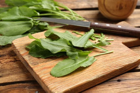 Fresh cut sorrel leaves on wooden table, closeupの写真素材