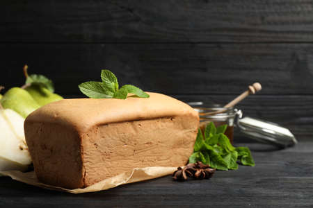 Tasty pear bread and mint on black wooden table. homemade cake