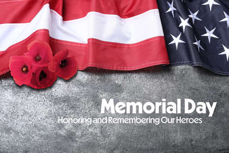 Memorial Day, Honoring and Remembering. American flag and red poppy flowers on gray backgroundの写真素材