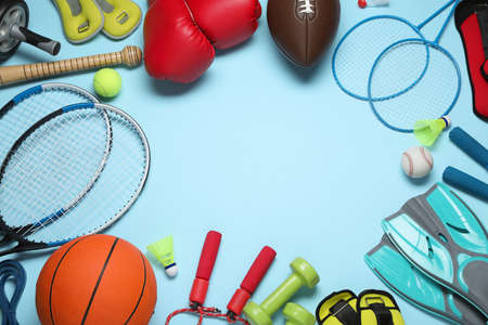 Set of different sports equipment on light blue background, flat lay. Space for textの写真素材