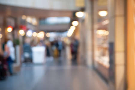 Blurred view of shopping mall with different stores, bokeh effectの写真素材