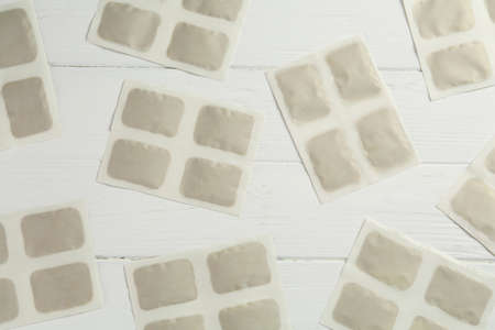 Mustard plasters on white wooden table, flat lay