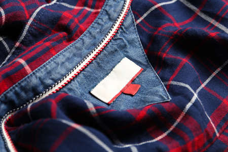 Blank clothing label on checkered shirt, closeupの写真素材