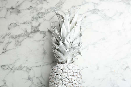 White pineapple on marble background, top view. creative conceptの写真素材
