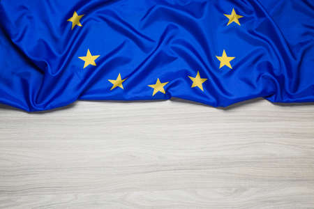 Flag of European Union on wooden table, top view. Space for textの写真素材