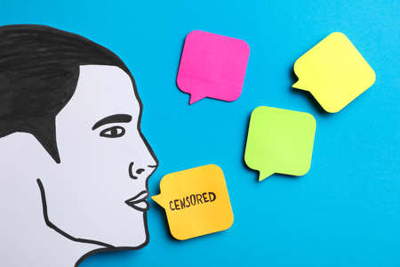 Notes with word Censored and man's head cutout on light blue background, flat layの写真素材