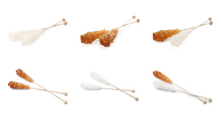 Set of wooden sticks with sugar crystals on white background. Tasty rock candiesの写真素材