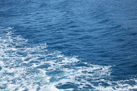 Surface of beautiful sea water with foam as background