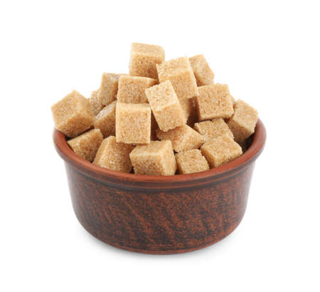 Bowl with cubes of brown sugar isolated on whiteの写真素材