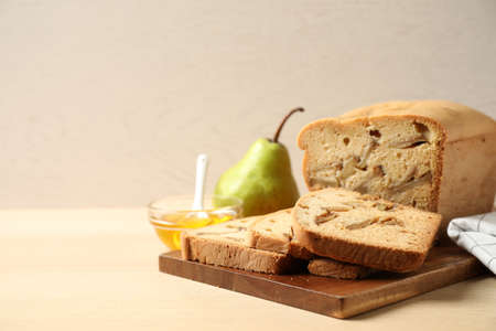 Composition with tasty pear bread on wooden table. homemade cakeの写真素材
