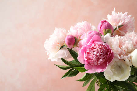 Beautiful peony bouquet on pink background, closeupの写真素材