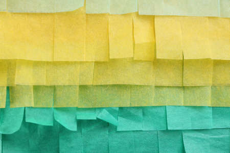 Cut tissue paper in different colors as backgroundの写真素材