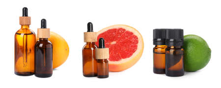 Set with bottles of different citrus essential oils and fresh fruits on white background. banner designの写真素材