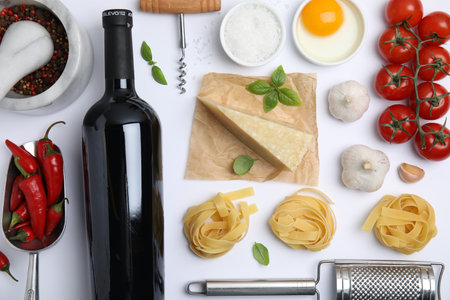 Flat lay composition with wine and fresh ingredients on white backgroundの写真素材